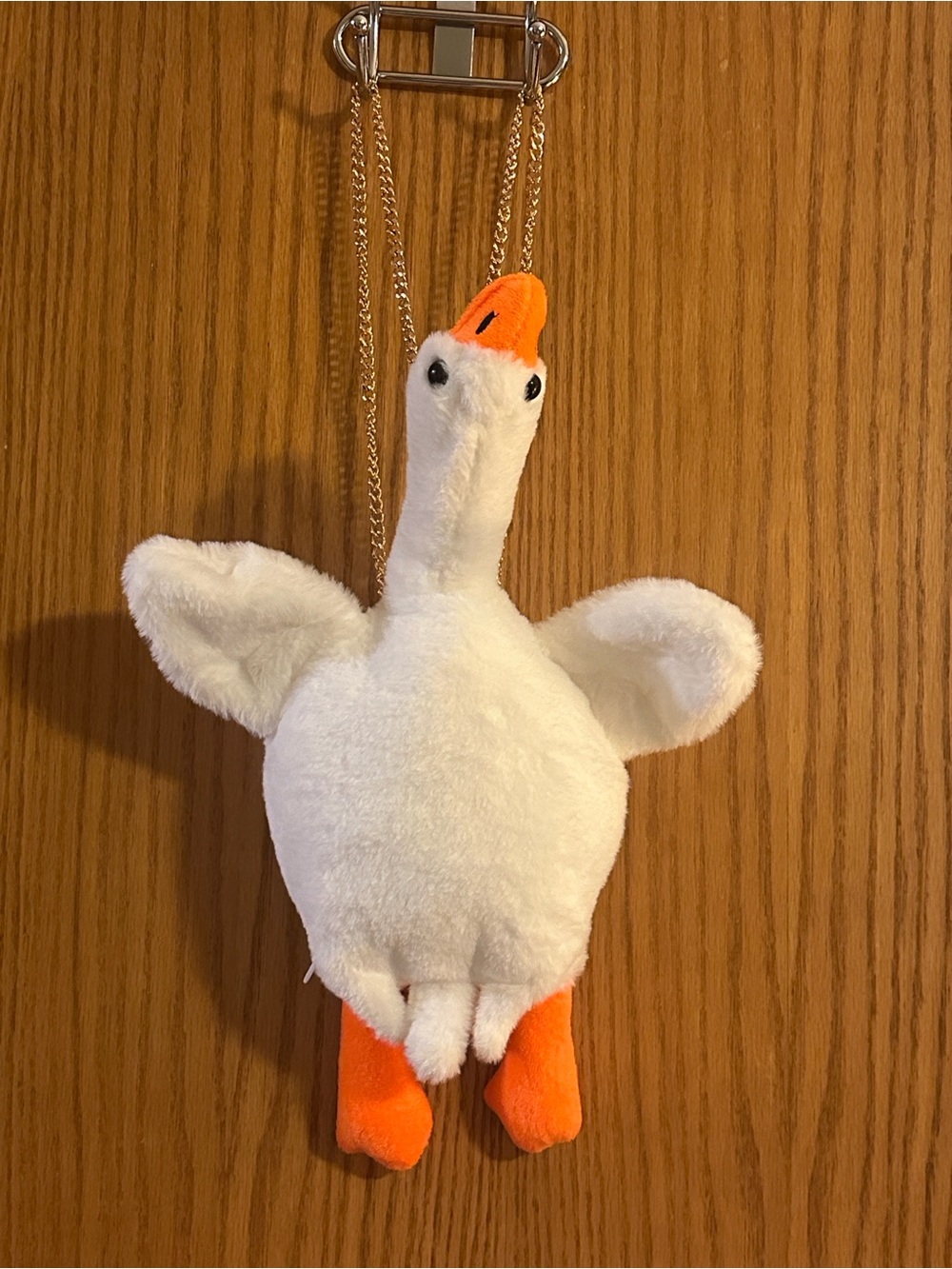 Plush orange and white duck backpack purse with chain strap
